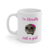 White ceramic mug with a meme-style hamster wearing a pink bow and the quote “I’m literally just a girl” – a funny and cute gift mug for girls.