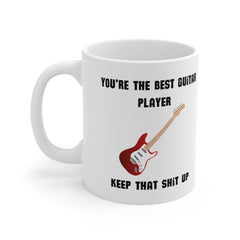 White ceramic mug with a red electric guitar illustration and the phrase “You’re the Best Guitar Player – Keep That Sh*t Up” – funny gift for musicians.