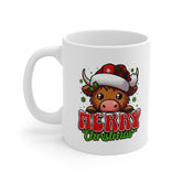 White ceramic mug with cute cartoon Highland cow in a Santa hat, snowflakes, holly, and the words “Merry Christmas” in festive red and green.