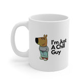 White ceramic mug featuring a cartoon character in jeans and a jumper with the text “I’m Just A Chill Guy” – funny, relaxed coffee cup design.