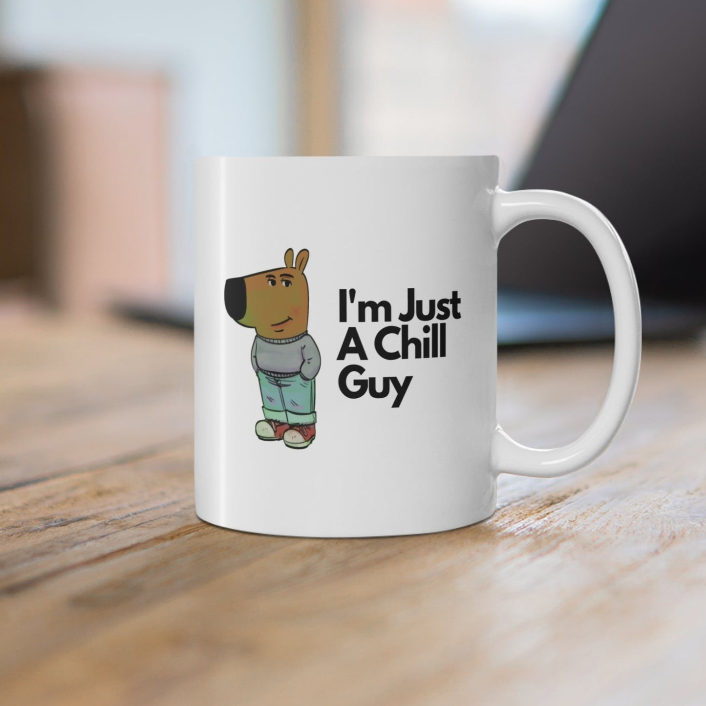 White ceramic mug featuring a cartoon character in jeans and a jumper with the text “I’m Just A Chill Guy” – funny, relaxed coffee cup design.