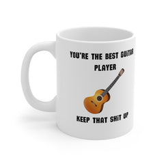 White ceramic mug with an acoustic guitar illustration and the phrase “You’re the Best Guitar Player – Keep That Sh*t Up” – funny music gift for guitarists.