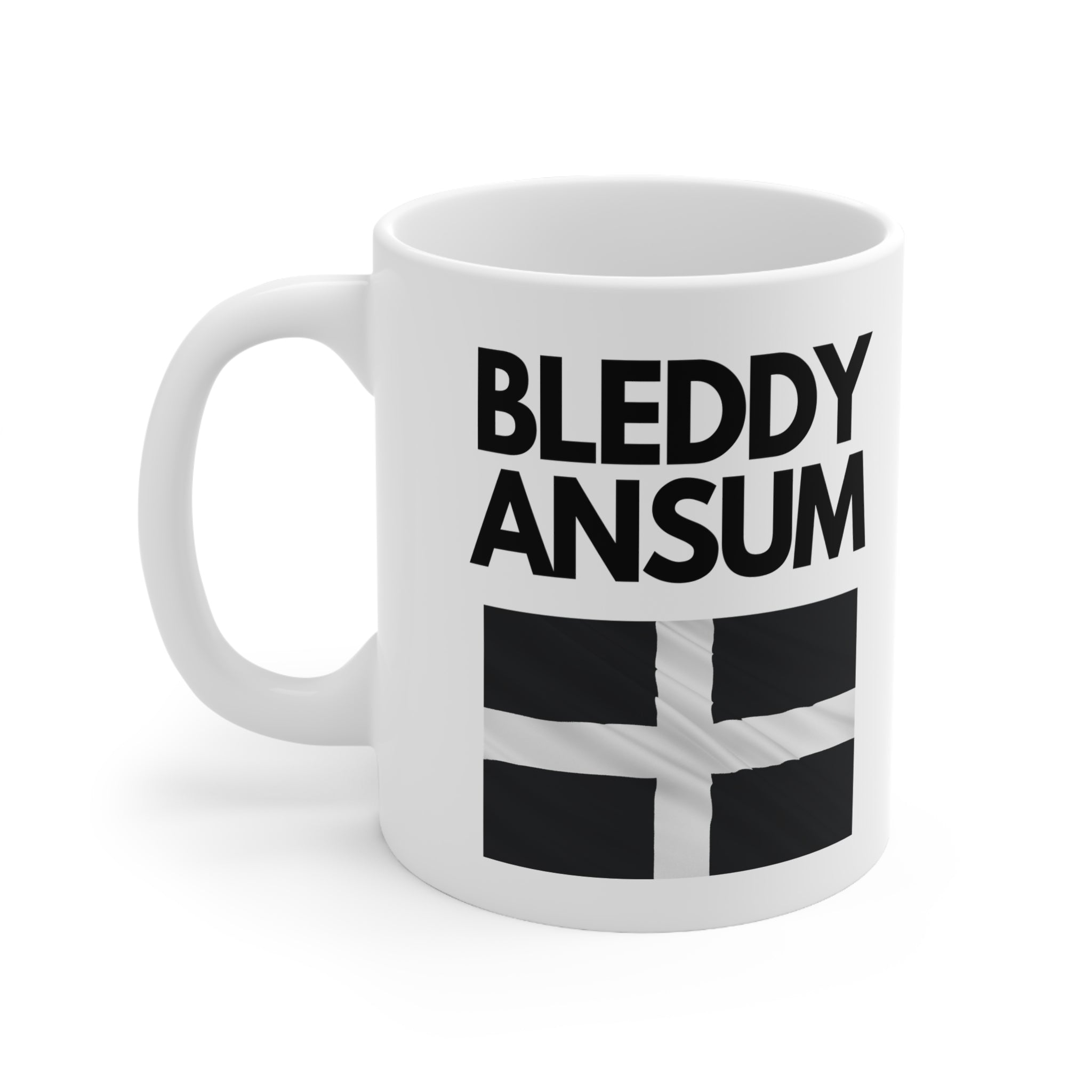 White ceramic mug with bold text “Bleddy Ansum” and the black and white Cornish flag (St Piran’s Flag) – a funny Cornwall-themed coffee mug.
