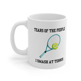 White ceramic mug with a tennis racket and ball illustration and the text “Tears of the People I Smash at Tennis” – funny mug for tennis players.