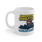 White ceramic mug with cartoon F1 driver in blue race car, the phrase “Smooth Operator,” and “Carlos Sainz” text – inspired by F1 and team radio moments.