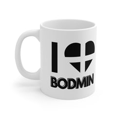 White ceramic mug with the text “I ❤️ Bodmin” and a heart in the Cornish flag – the perfect Cornwall gift or souvenir for lovers of Bodmin and its history.