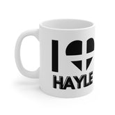 White ceramic mug with the text “I ❤️ Hayle” and a heart in the Cornish flag – the perfect souvenir for lovers of Hayle and the Cornish coastline.
