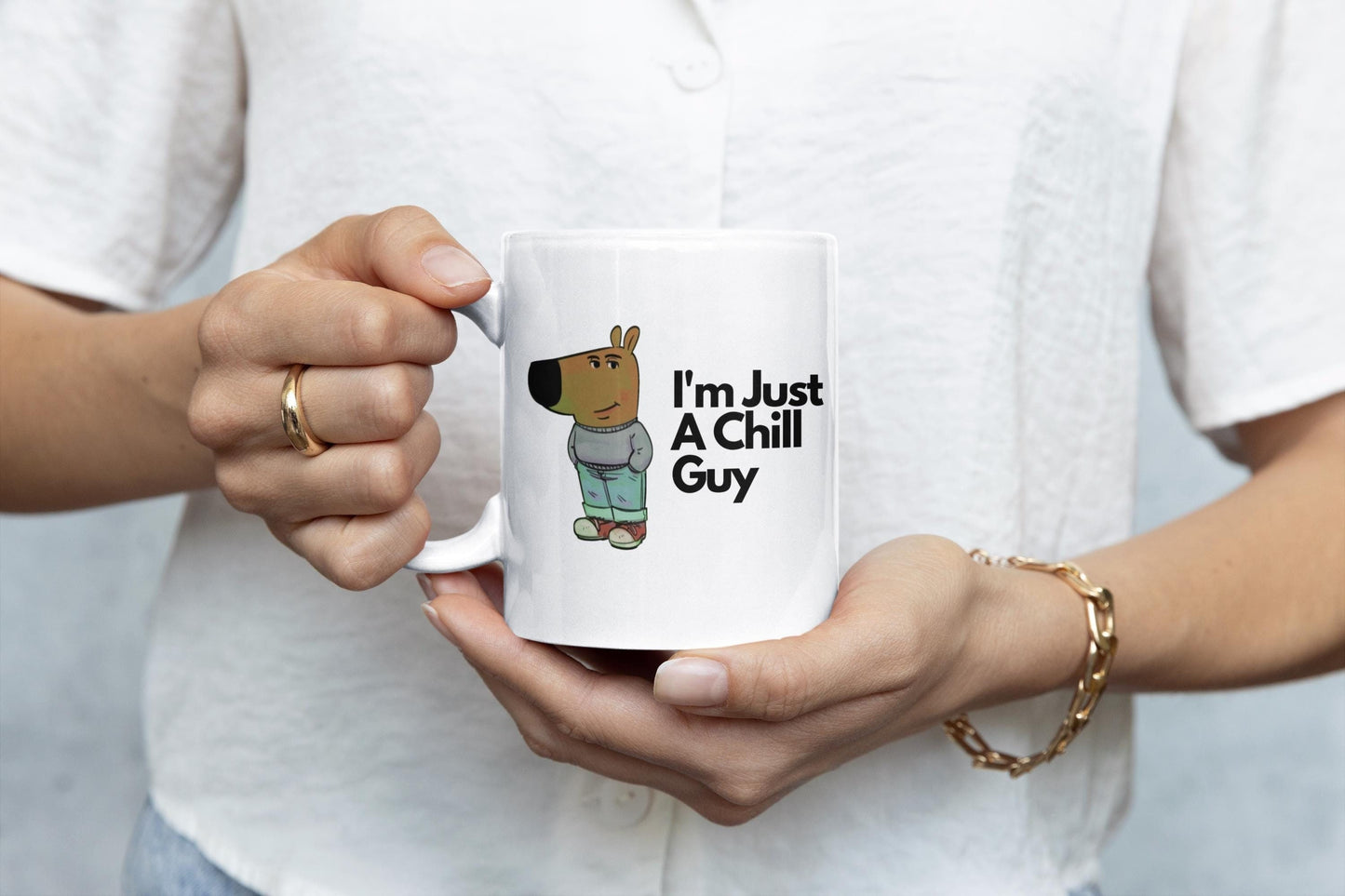 White ceramic mug featuring a cartoon character in jeans and a jumper with the text “I’m Just A Chill Guy” – funny, relaxed coffee cup design.