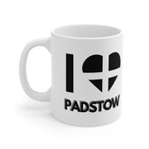 White ceramic mug with the text “I ❤️ Padstow” featuring a heart designed from the Cornish flag – a perfect Cornwall souvenir or Padstow-themed gift.