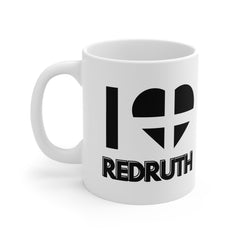 White ceramic mug with the text “I ❤️ Redruth” and a heart styled in the Cornish flag – a great gift or souvenir for lovers of Redruth and Cornwall heritage.