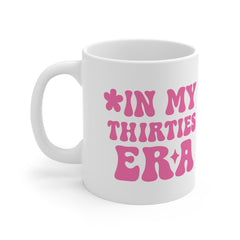 White ceramic mug with bold pink retro text reading “In My Thirties Era” – a funny and empowering gift for women turning 30 or embracing their 30s.