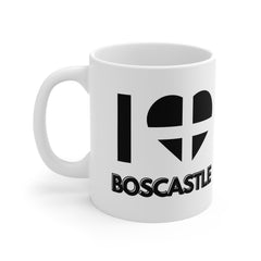 White ceramic mug with “I ❤️ Boscastle” text and a heart in the Cornish flag design – perfect for Cornwall lovers and Boscastle souvenir collectors.