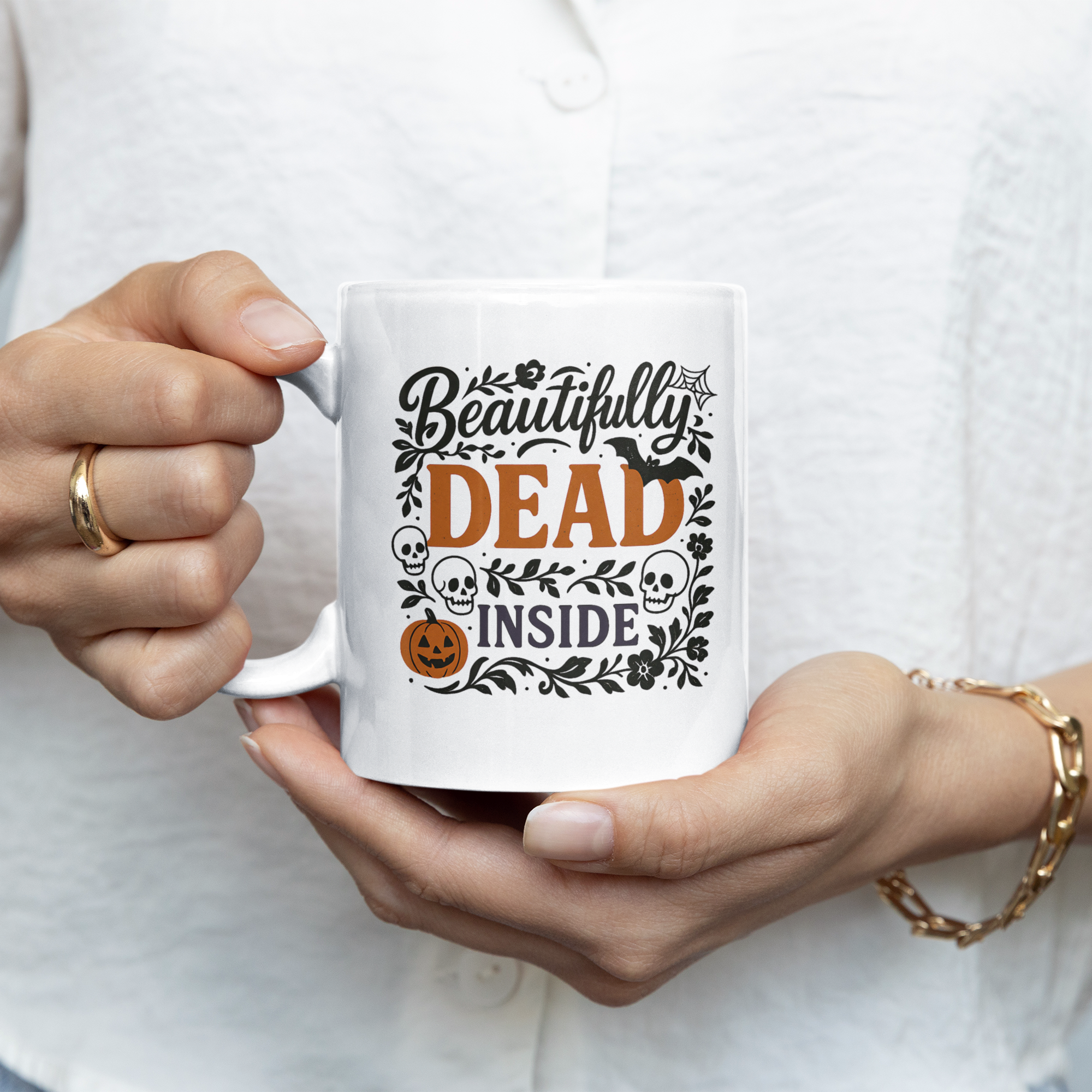 Person holding a mug with 'Beautifully Dead Inside' text design.