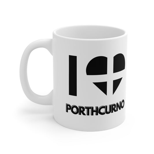 White ceramic mug with the text “I ❤️ Porthcurno” and a heart in the Cornish flag – a perfect Cornwall souvenir for beach lovers and Minack Theatre fans.

