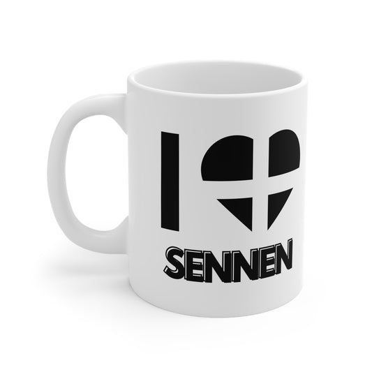 White ceramic mug with the text “I ❤️ Sennen” and a heart in the Cornish flag design – the perfect gift or souvenir for lovers of Sennen and the Cornwall coast.
